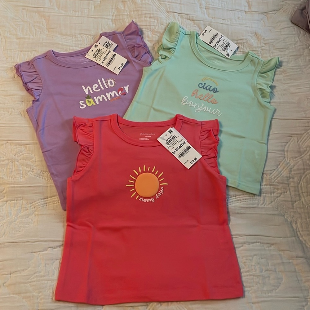 Bundle of three brand new 24 month summer shirts still in their bags .